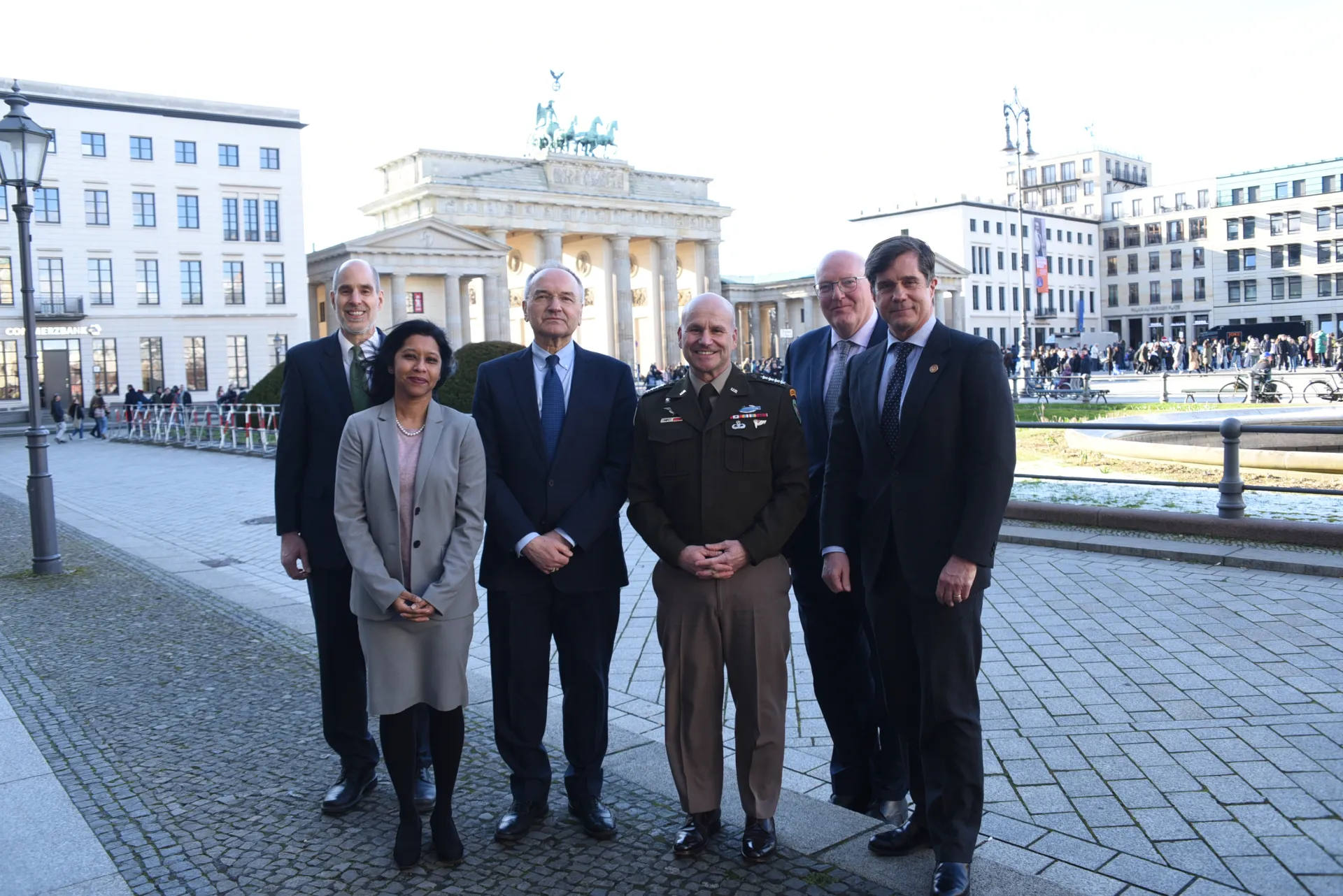 Group picture with General Christopher G. Cavoli in front of the Brandenburg Gate at anniversary conference in Berlin, March 2023