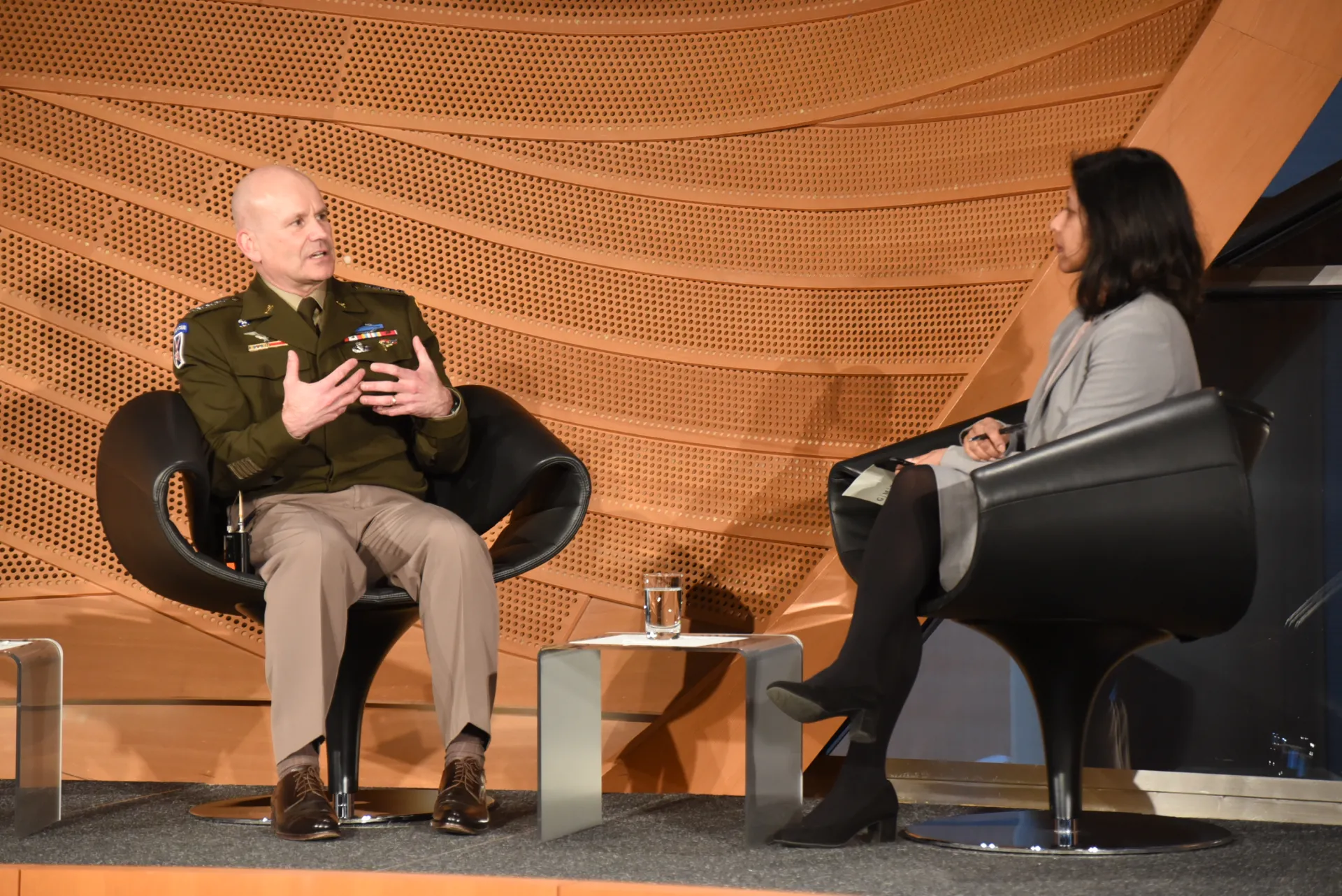 General Christopher G. Cavoli and Sudha David-Wilp discussing at anniversary conference in Berlin, March 2023