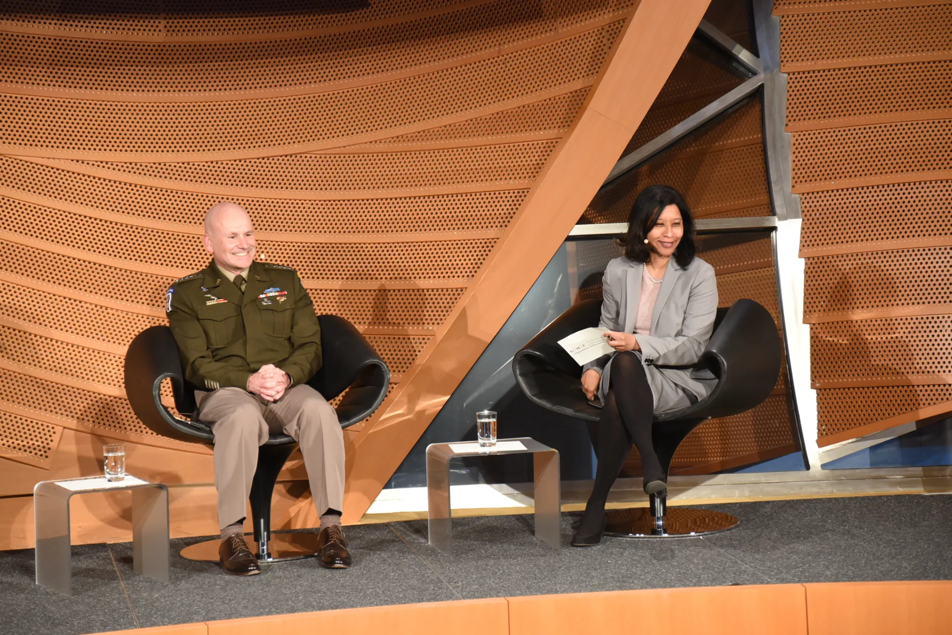 General Christopher G. Cavoli and Sudha David-Wilp discussing at anniversary conference in Berlin, March 2023