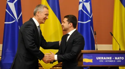  NATO Secretary General Jens Stoltenberg speaks to Ukrainian President Volodymyr Zelensky after the Ukraine-NATO Commission meeting