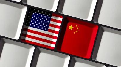 US flag and Chinese flag on a keyboard