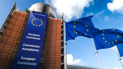 Brussels / Belgium - 11/10/2019 - European Union flags waving in wind in front of European Commission building.