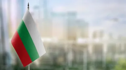 Small flags of the Bulgaria on an abstract blurry background.