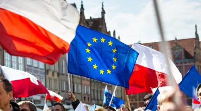 Gdansk, Poland, 05.03.2016 - people with flags of EU and Poland during demonstration in the defense of the constitution organized by Committee for the Defense of Democracy (KOD)