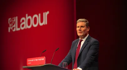 Keir Starmer, leader of the Labour party, on a stage at a podium