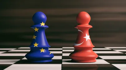 Turkey and European Union flags on chess pawns on a chessboard. 3d illustration