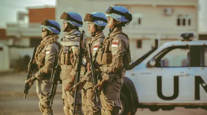 Row of Indonesian soldiers wearing UN helmets