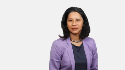 Woman with purple blazer and shoulder length dark hair