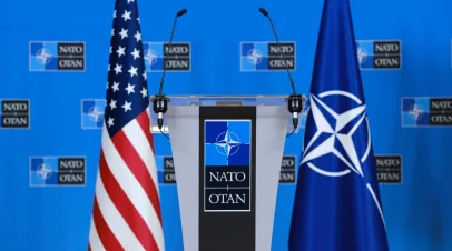 US flags stand in press room at the NATO headquarters in Brussels, Belgium on April 5, 2023.