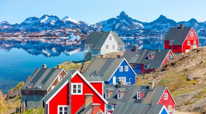 Picturesque village on coast of Greenland - Colorful houses in Tasiilaq, East Greenland