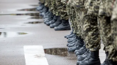 Row of soldiers photographed from the waist down