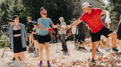 06.08.2022 Irpin, Ukraine: Ukrainian volunteers are rebuilding the destroyed post-war houses of civilians who suffered losses from Russian tanks and artillery Shutterstock / Malinskyi Max
